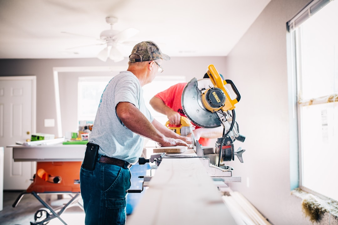 Services Man Standing Infront Of Miter Saw Wewtgkpuvt0